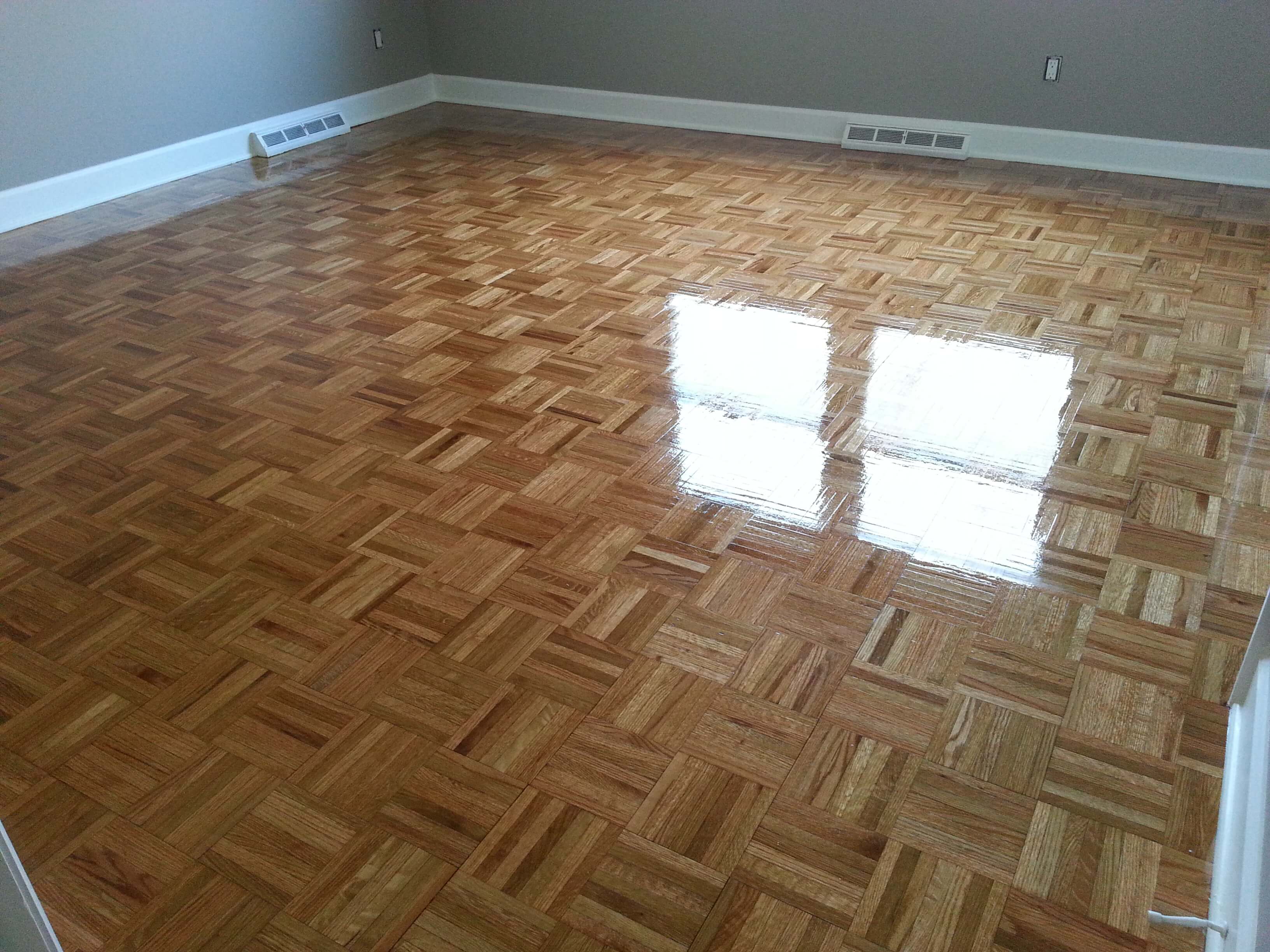 A recently refinished parquet wood floor
