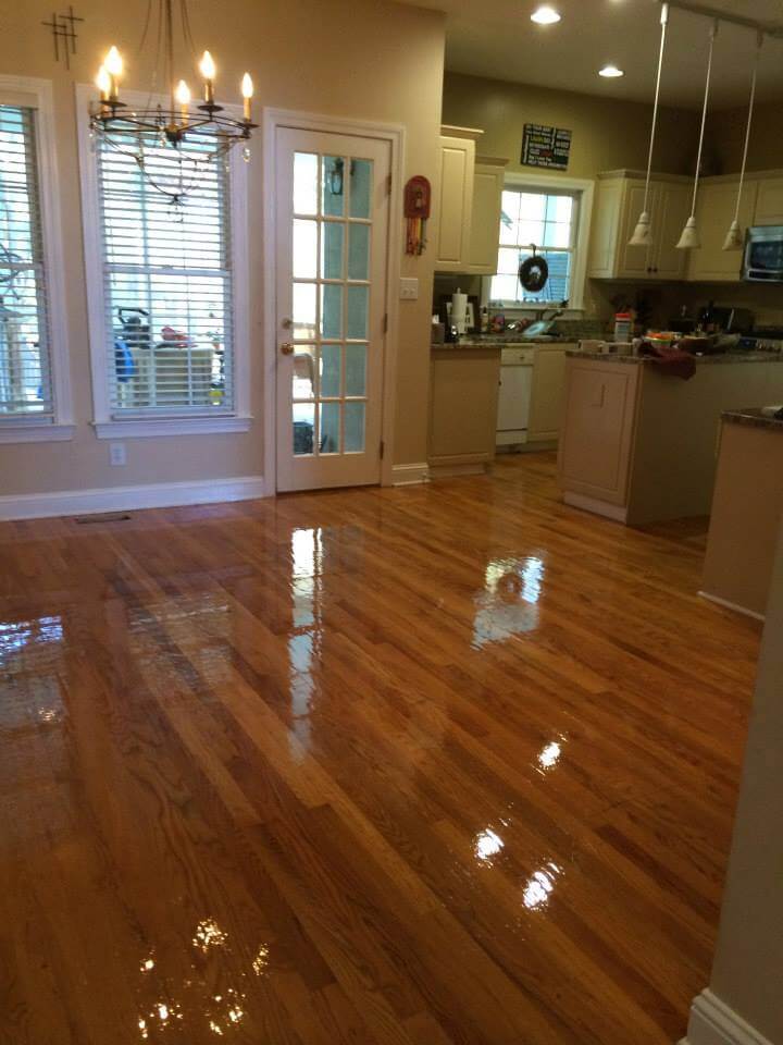 a shiny resurfaced hardwood floor in a kitchen