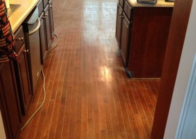 a hardwood floor before being refinished